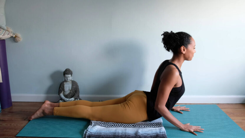 A girl is stretching in the cobra pose